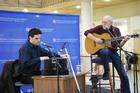 Peter Yarrow (r) and Humayan Khan (l) perform in the School of International Service Atrium on Wednesday, February 29. Photo by Annie Lyon.